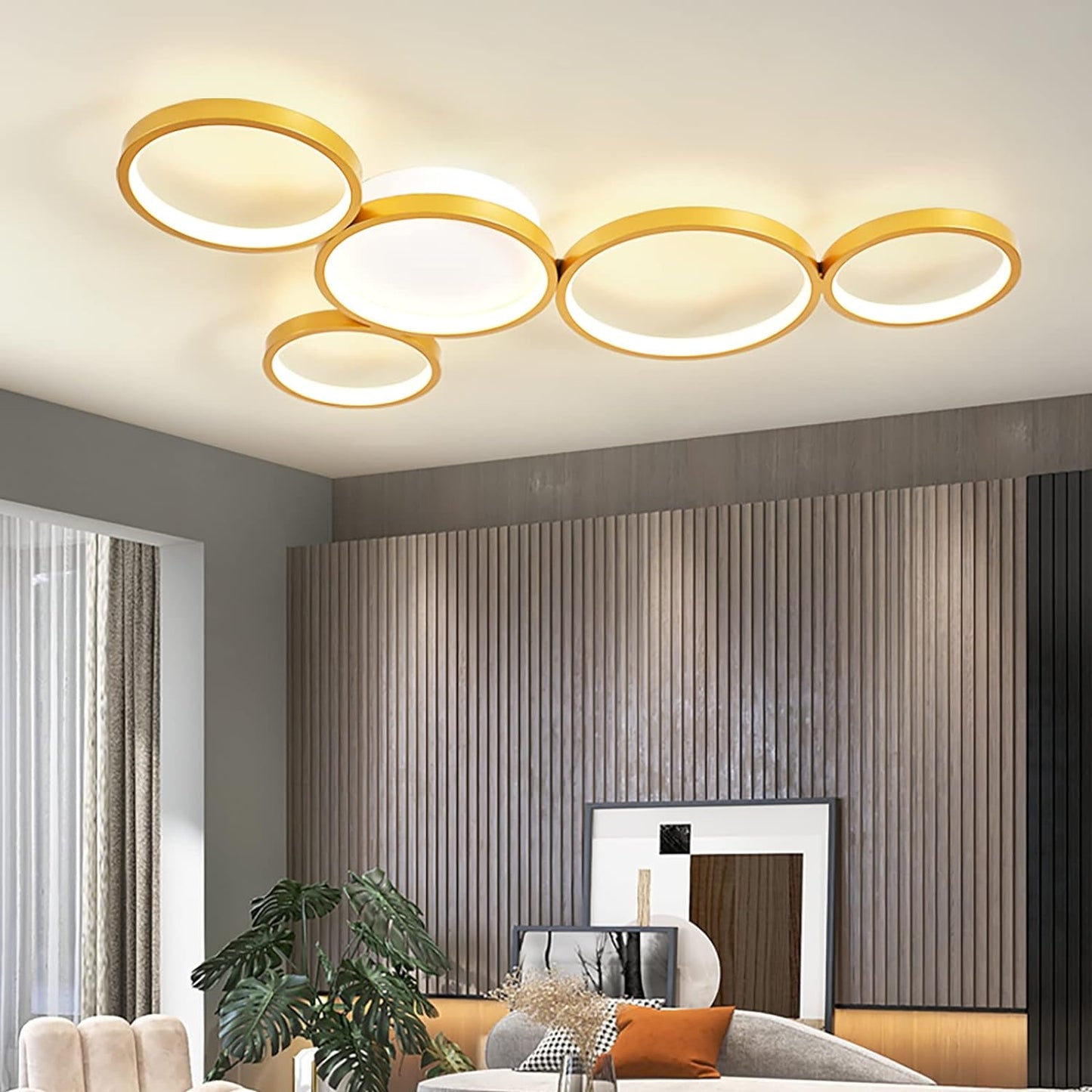 Modern ceiling light fixture in a living room setting with neutral colors.