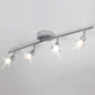 Ceiling light fixture with four spotlights on a white ceiling