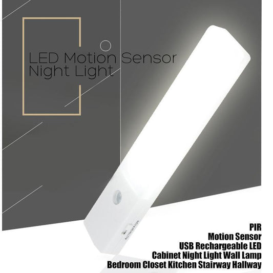 A white motion sensor LED night light with a sleek design, showing the sensor part on the top and the LED light on the bottom. The product is advertised as USB rechargeable with capabilities of detecting motion and light, suitable for various indoor locations.